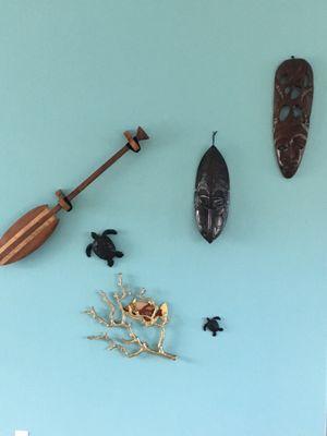 I found these great Polynesian masks and Kia wood paddle!