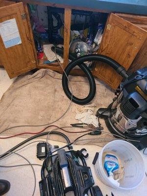 Water jetting a kitchen sink branch drain with grease buildup