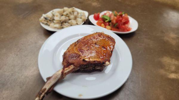 Sous vide tomahawk pork chop finished in a million degree oven with herb butter? Sure.