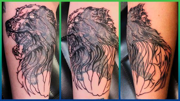 Quadruple cover up tattoo  1.a cross 2.a skull 3.a bear 4. My Werewolf tattoo,  1st session, only an outline so far.