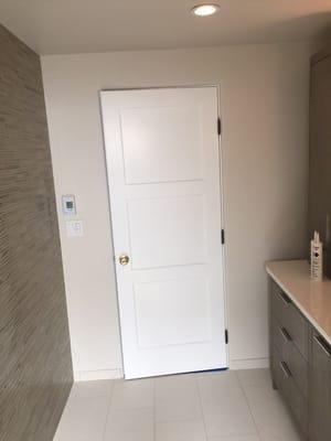 Newly remodeled bathroom painted. Spray finish on door