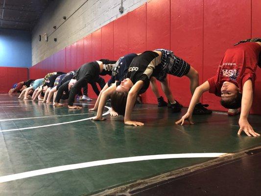 High bridges during wrestling class in Brooklyn