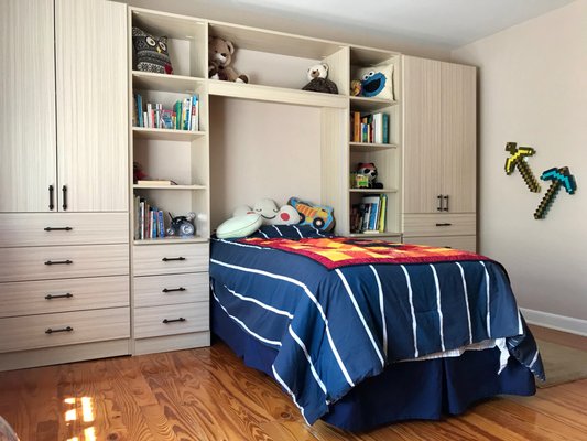 Kid's bedroom organization with LED lighted bed surround, hamper and many solid wood drawers. See matching Lego center on our Houzz site.