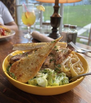 Fettuccine Alfredo with chicken, broccoli and garlic bread.