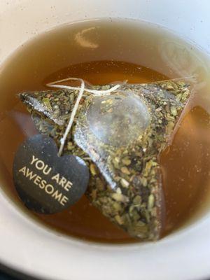 Hot tea in a reusable mug for tenants