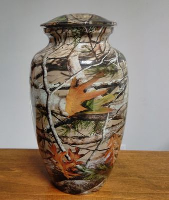 This camouflage Adult Cremation Urn features a forest pattern perfect to memorialize a hunter or outdoor person.