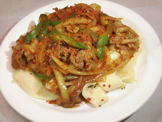 Cumin lamb noodle (cumin, lamb, onion and jalapeno over wide noodles)