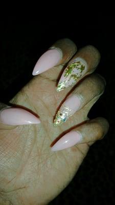 My fill in... Medium length stilleto nails W/ a foil nail and accent bling nail