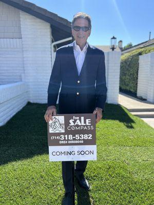 Craig Ratowsky with a coming soon sign in Irvine for our new listing 13 Willowbrook.