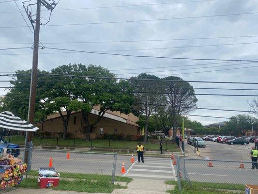 Extra parking across the street, Police control traffic and crossing guards.