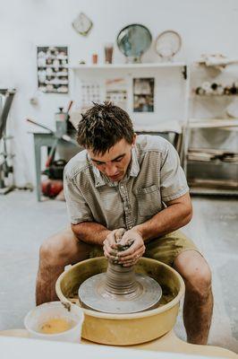 Sutter, owner on the pottery wheel