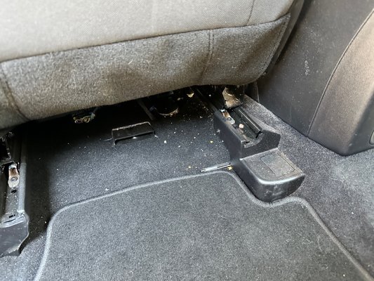 These are crumbs behind the driver seat.  I also found fries which I threw out.