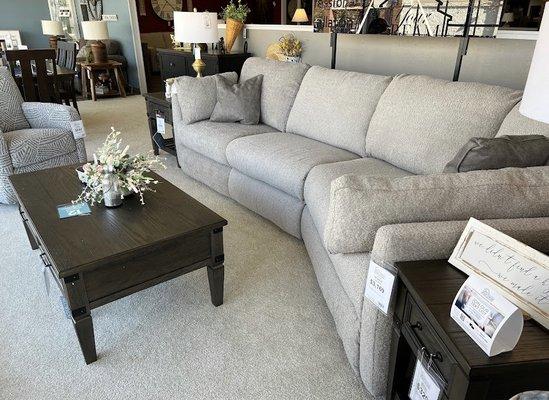 Southern Motion Reclining sofa with cuddles option.