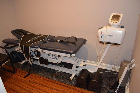 Non-surgical Spinal Decompression is performed on our Traction Table