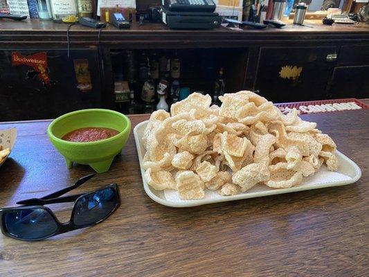 Fresh cooked pork rinds with salsa on the side. This is one order.  Excellent!