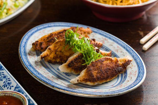 Wok Seared Long Dumplings, Berkshire pork, garlic stems, black vinegar