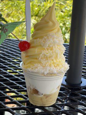 Pineapple Dole sundae.  Pineapple dole whip  Toasted coconut  Cake