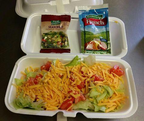 Side salad - lettuce, tomatos, cheddar cheese and croutons. 1 packet of dressing included