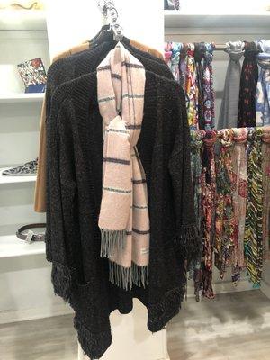 Long cardigan with fringe detail.