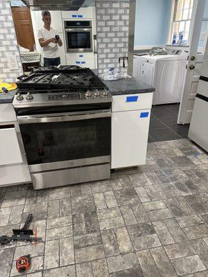 install new flooring and kitchen cabinets