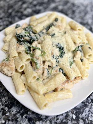 Chicken Florentine Dinner. Grilled Chicken and Spinach over Pasta finished with a Garlic Alfredo Sauce