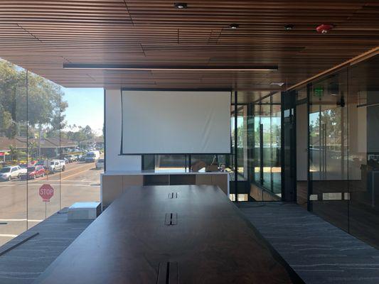 Projector concealed in wood blade ceiling