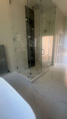 Custom 9FT Frameless, Floor to Ceiling Glass Shower Installation.