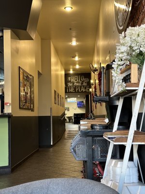 Hallway from front of cafe toward seating in back