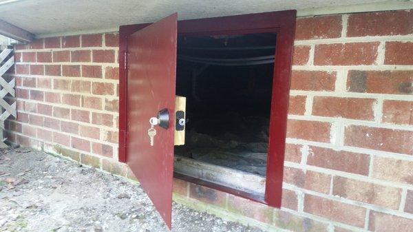 Metal crawl space door.