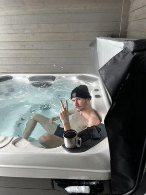 My son relaxing in the spa on One of the worst storm days of last season.