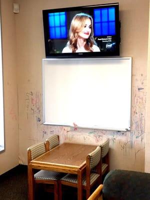 TV w/ kids table and white board (looks like some kids missed the board!)