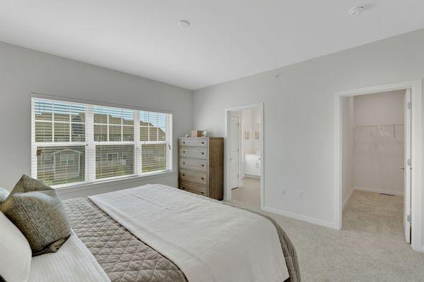 Master bedroom equipped with private bathroom and walk-in closet