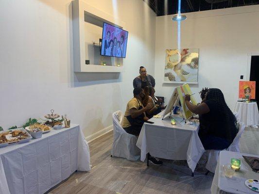 Interior - during a Paint n' Sip event! This space can be used for any event you want to have