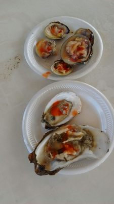 Clams n oysters with vinager n hot sauce.