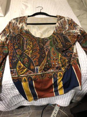 Red, blue, yellow bold stripped at the hem of the waist and geometric shapes, and flowers knit blouse. Going to rock with my black jeans.