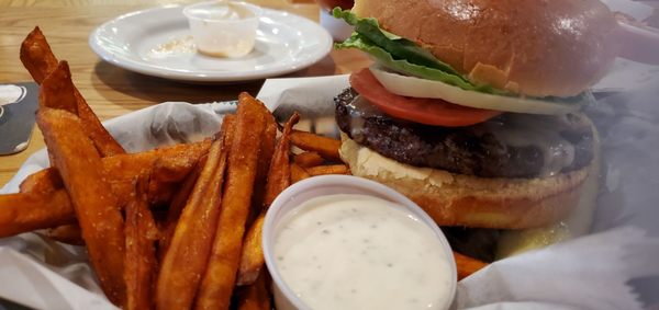 Sweet pot fries with mushroom Swiss burger, perfectly prepared.