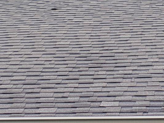 My roof after many, many attempts to fix. Not sealed and curling in areas