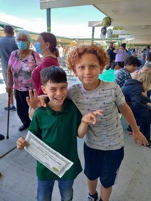 My son is the one in green with his friend at the end of the year award ceremony!!