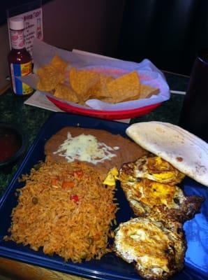 Huevos rancheros with rice, beans, and flour tortillas. (6.75 for dinner)