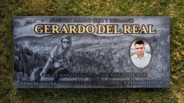 Headstone with gold leaf and ceramic tile in loving memory