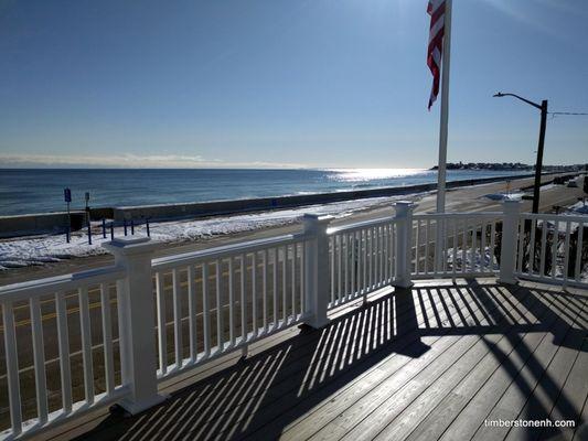 Composite and PVC deck on the ocean. Project included new sliding door.