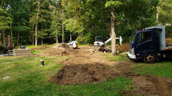 Another customer needed their backyard regraded. This is during/ at the start of the project.