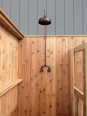 Custom outdoor shower with designer shower head.