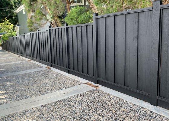 New redwood fence looking down the driveway.