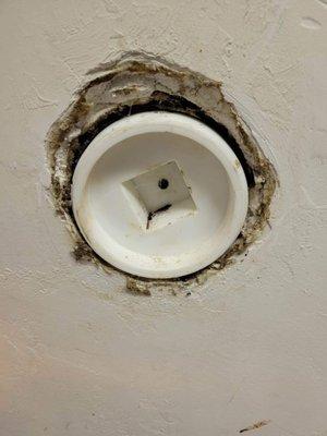 sewer, clean out cap in the wall.