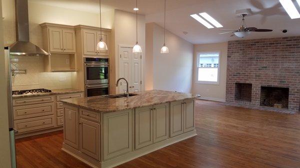 A 22' structural wall was removed, and the entire space was remodeled to create this open-concept living space