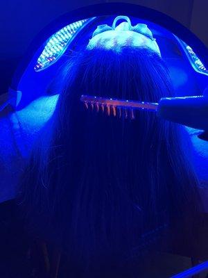 High frequency scalp treatment. Blue light led treatment.