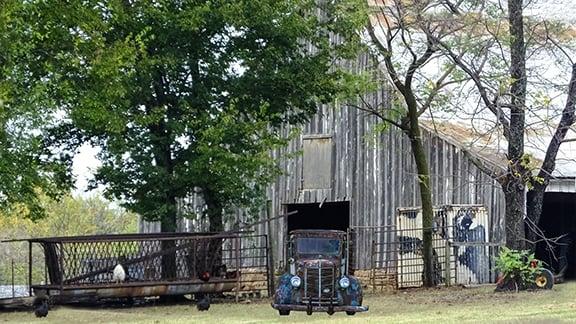 Mac Truck leaving Barn