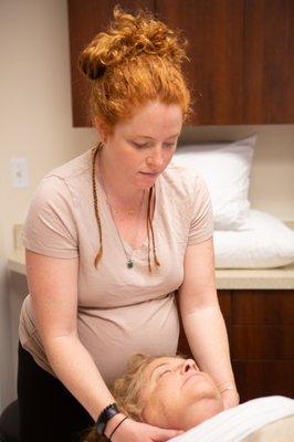 Sarah treating a patient to a bit of energy healing