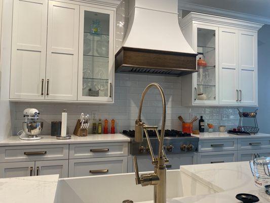 Wall cabinets and an incredible custom rangehood view